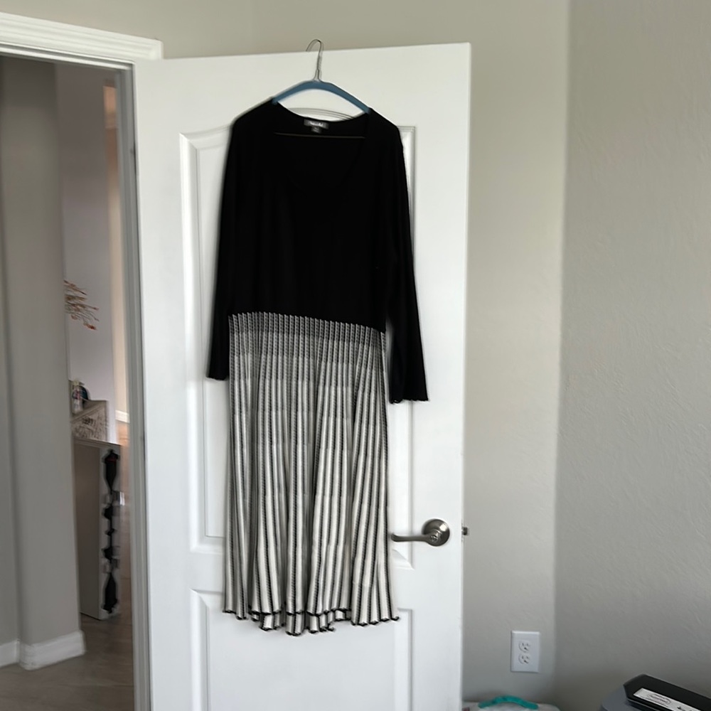 Light knit material.  Very well finished (see photo of hemline) great for work